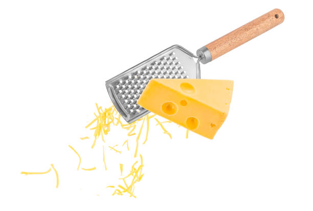 istock Piece of cheese is rubbed on a hand grater isolated on white 2195122932