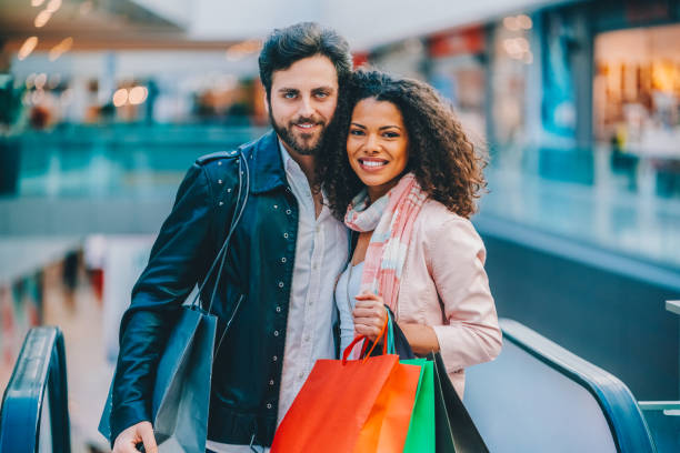 istock Young couple in the shopping mall 2195125954