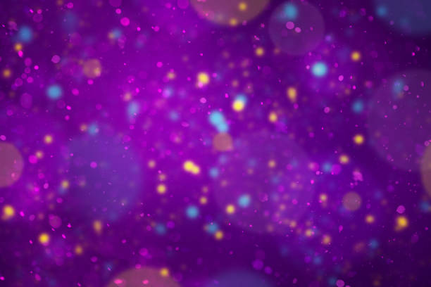 istock Abstract purple background with unfocused particles, blue and gold confetti 2195129583