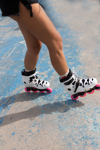 istock Woman in roller blades in skate park 2195130469