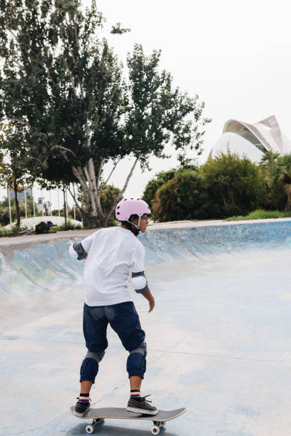 istock Young person with skateboard in skate park 2195130702