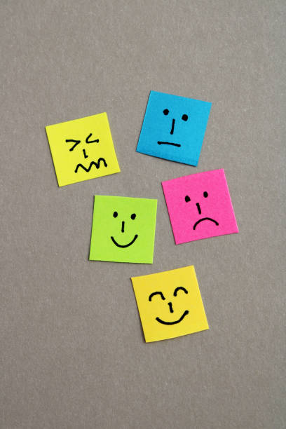 istock Group of colorful papers with different facial expressions - vertical format 2195137712
