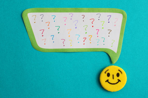Yellow happy face next to bubble full of colorful question marks
