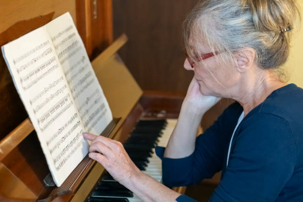 Piano keys and music notes selective focus image