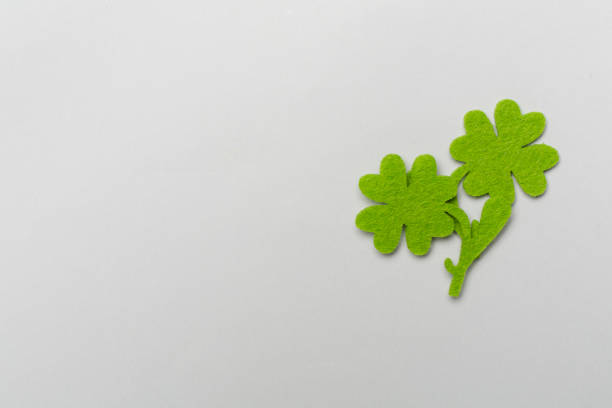 istock Felt clover leaves on color background, top view. St. Patricks day concept 2195143691