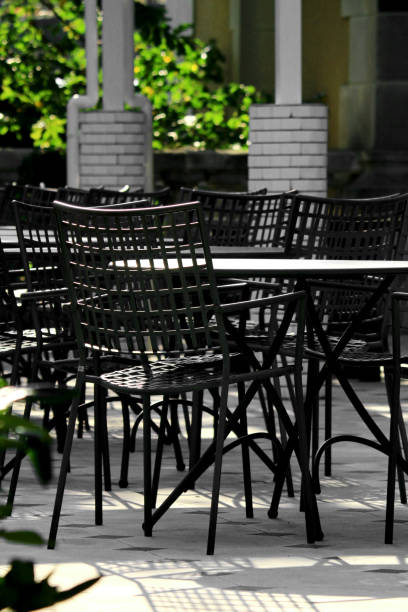 istock A modern courtyard with cafe tables and chairs in a black and white design 2195147904