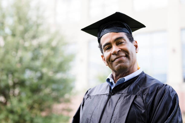 istock Proud Graduate in Cap and Gown, Smiling at Camera 2195149798