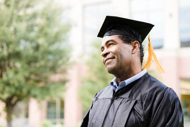 istock Proud Graduate in Cap and Gown, Hopeful Future 2195149802