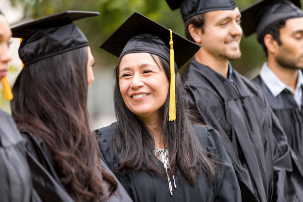 istock Happy Graduate in Cap and Gown at Ceremony 2195149820