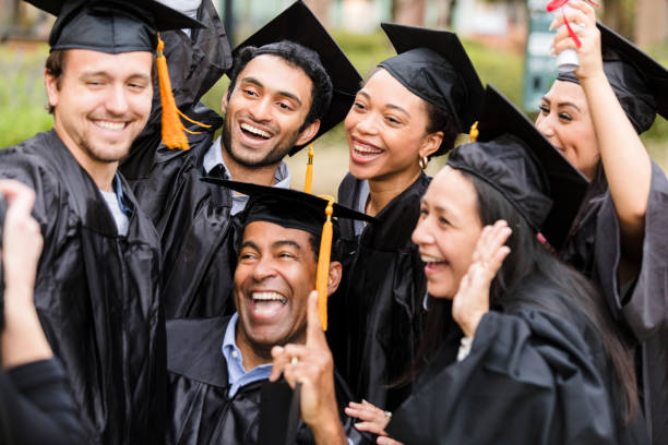 istock Joyful Diverse Graduates Celebrating Success Together 2195149822