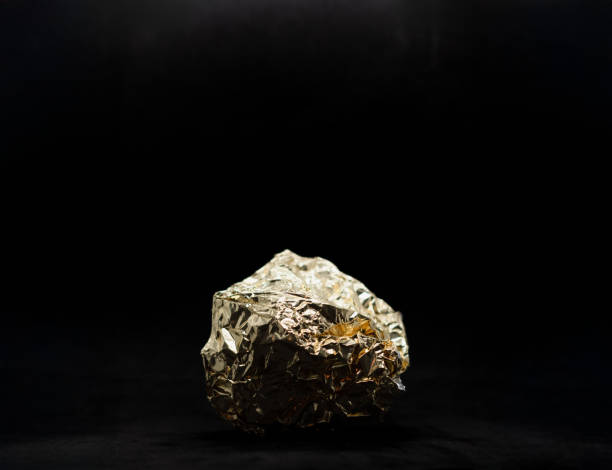 a ball gold foil on black background