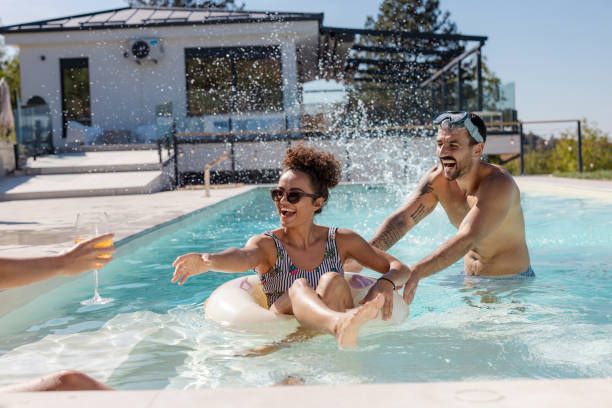 istock Summer fun - Cheerful friends enjoying a day on the pool 2195152707