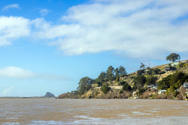 Houses built into the cliffs over the water in Jenner, California