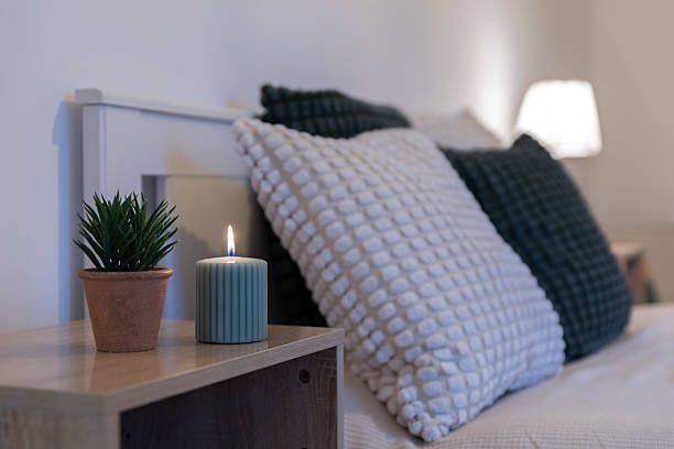 istock Home interior with comfortable bed with double bed with green and white pillow, lamp and white wall in new apartment. Design indoors architectue. Real estate. 2195155166