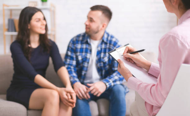 istock Couple Engaged in Counseling Session With Therapist in Modern Office Setting 2195157514