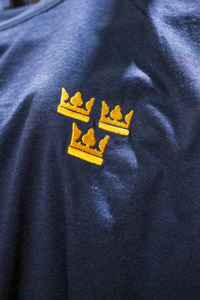 istock Tree yellow crowns on a blue t-shirt.. 2195157571