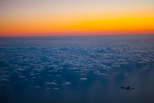 Sunset light from 30000 feet and over the clouds.