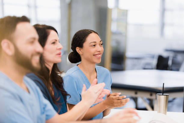 istock Diverse Healthcare Team Applauding During Meeting 2195157652