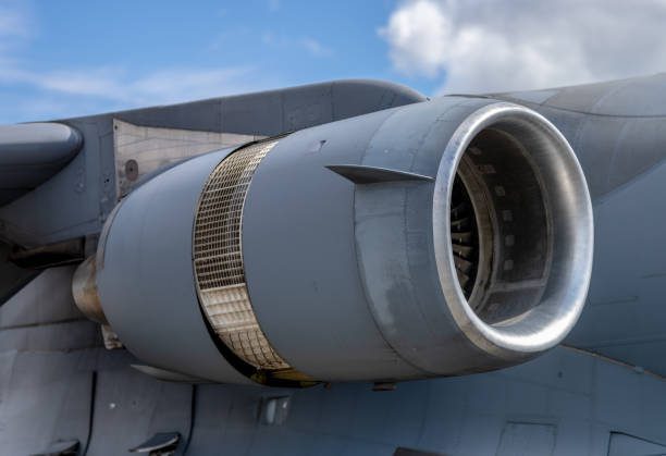 Adjustable exhaust nozzle with partly expanded diffusers - a variable area nozzle is required in a jet engine for optimal expansion and adjusting back pressure in the engine when the afterburner is operated, it avoids compressor surge problems due to the increased back pressure on the engine when the afterburner is lit - engines capable of supersonic flight have convergent-divergent exhaust duct features to generate supersonic flow - GE F110 afterburning turbofan jet engine on F-16 fighters - empennage close-up of exhaust and elevator.
