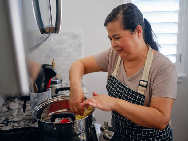 istock Mature Woman Making Tamales 2195162055
