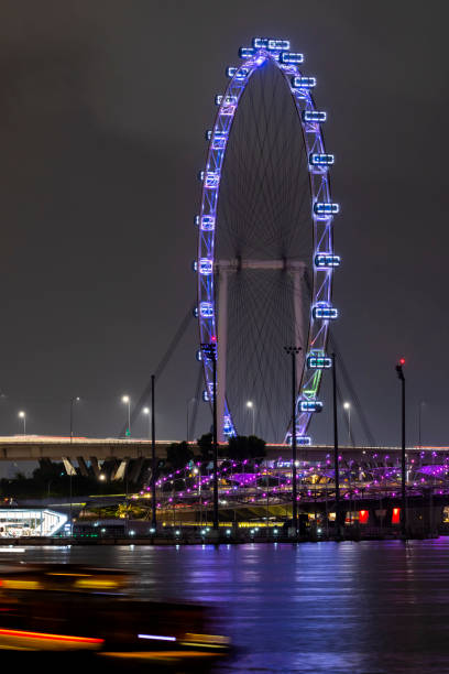 istock Singapore - Oct 22, 2019: Singapore Flyer ferris wheel at night 2195163659