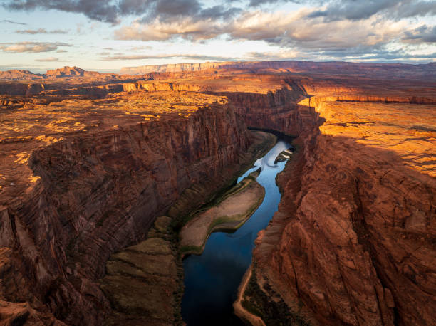Colorado river flowing through Glen Canyon at dawn defaultAerial view of Colorado river flowing through Glen Canyon near to Page in Arizona horseshoe bend river stock pictures, royalty-free photos & images