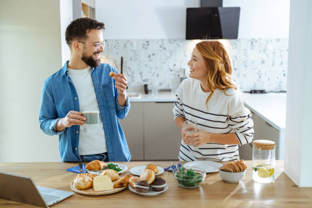 istock Couple enjoying a casual breakfast together in modern kitchen setting 2195167826