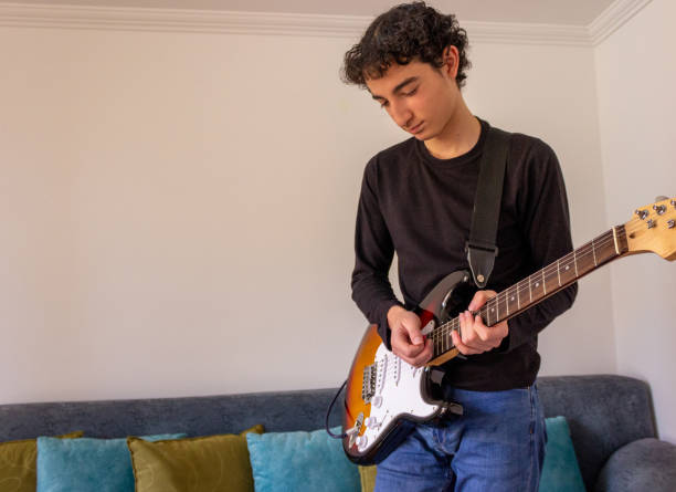 istock Young musician practice guitar 2195173468