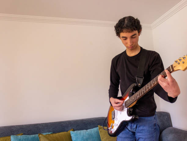istock Young musician practice guitar 2195173476
