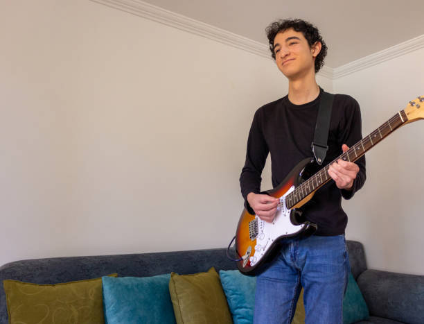istock Young musician practice guitar 2195173479