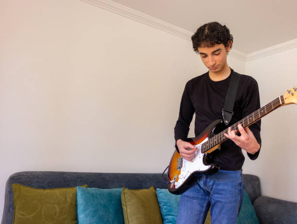 istock Young musician practice guitar 2195173486