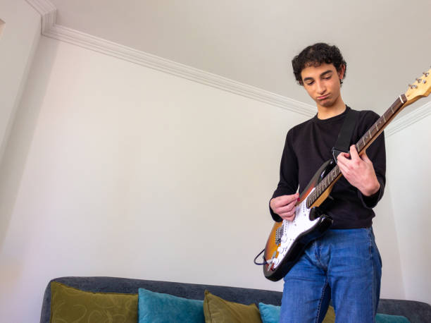 istock Young musician practice guitar 2195173488