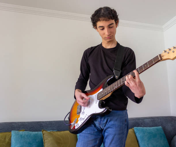 istock Young musician practice guitar 2195173508