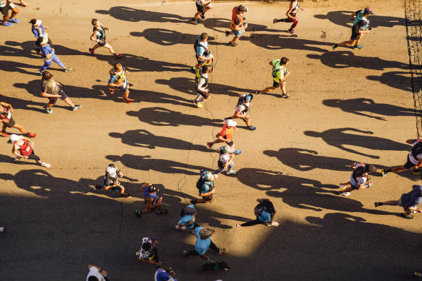 istock Group of people is running on the road. 2195175080
