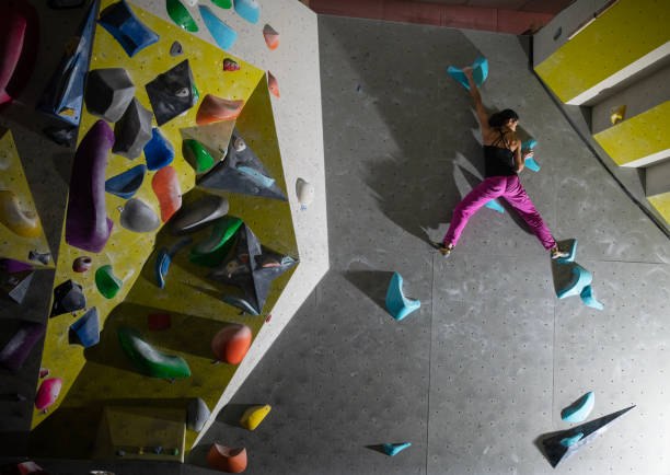 istock Sportswoman training climbing on indoor climbing wall. 2195175094