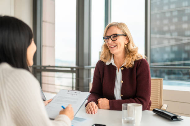 istock Professional Financial Advisor And Client Meet In Contemporary Office Setting 2195175602