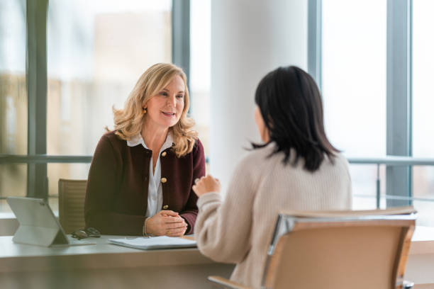 istock Professional Financial Advisor And Client Meet In Modern Corporate Office 2195175620