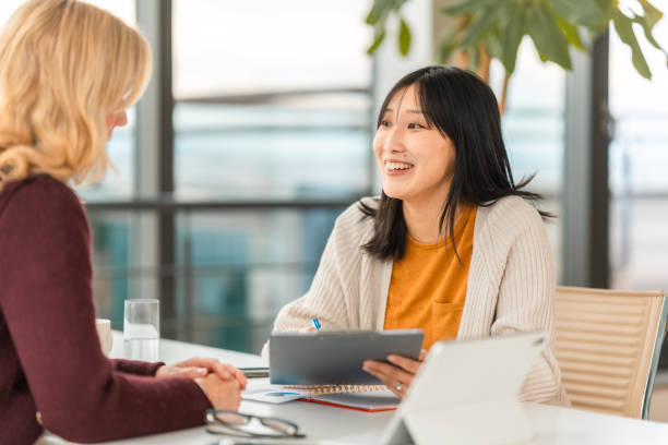 istock Professional Financial Advisor And Client Review Digital Plans In Modern Office 2195175704