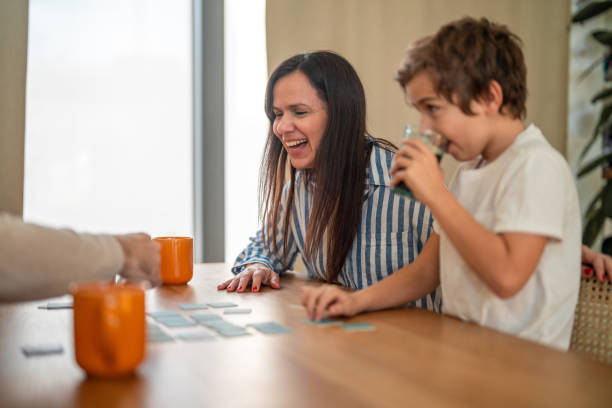istock Joyful Hispanic Family Engaging in Puzzle Activity at Home 2195175885