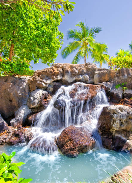 Water falls gently over a rocky surface.