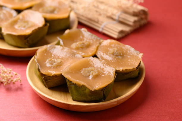 istock Sticky rice cake (Nian Gao), Chinese New Year cake on red background 2195184429