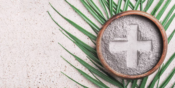 istock Ash wednesday banner with cross in ashes and palm leaf 2195189098
