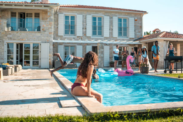 istock Friends Swimming at a Villa Pool Party 2195190698