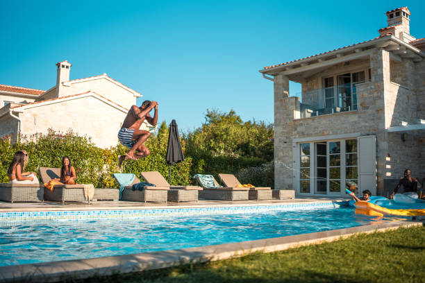 istock Joyful Black Male's Cannonball Jump 2195190699