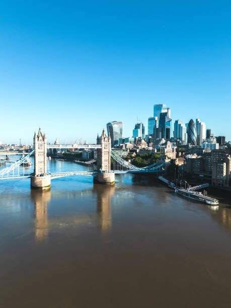 istock Tower bridge reflecting on thames river with cityscape in background 2195192127
