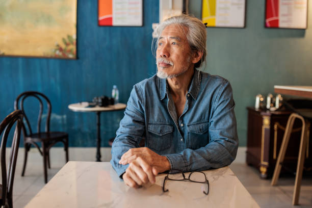 Senior man sitting in cafe