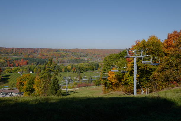 istock Autumn Mountain View with Colorful Trees, Grass, and Cable Car 2195196195