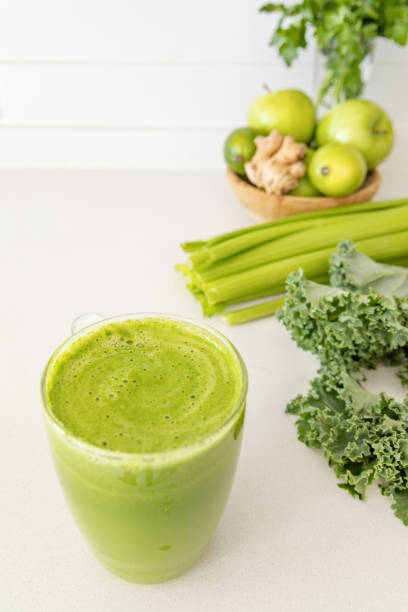 istock Green Detox Juice on White Kitchen Counter 2195196459
