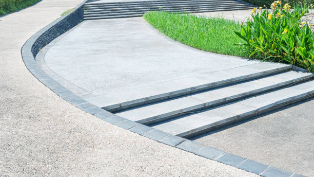 istock Curved pathway and stairs beside flowerbed 2195198290
