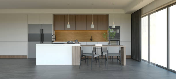 istock A modern kitchen featuring sleek cabinetry, a central island, minimalist decor, and large windows that provide natural light. 3d rendering. 2195198320